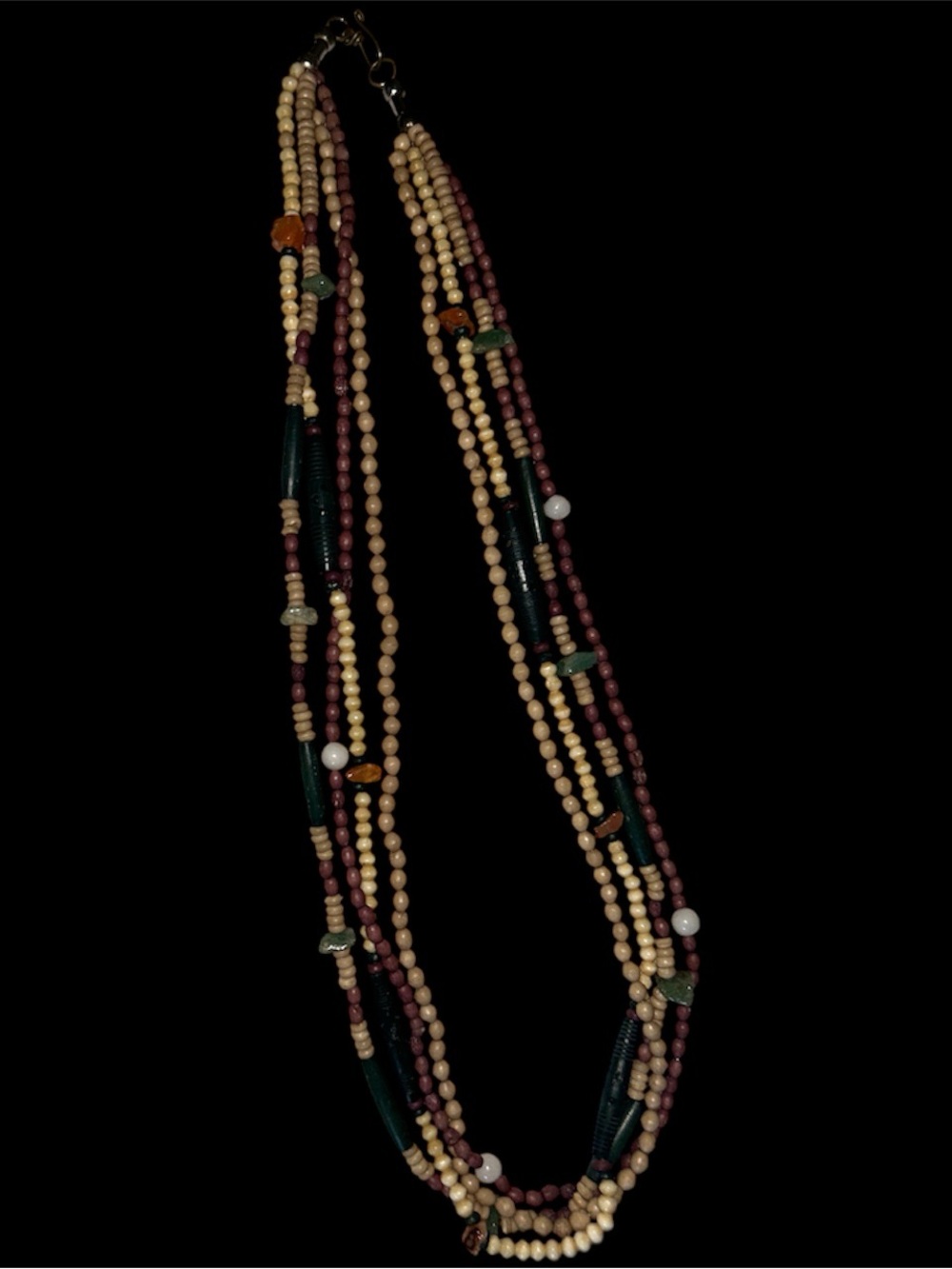 Vintage ethic vibe ceramic? And glass? Beads. Not plastic